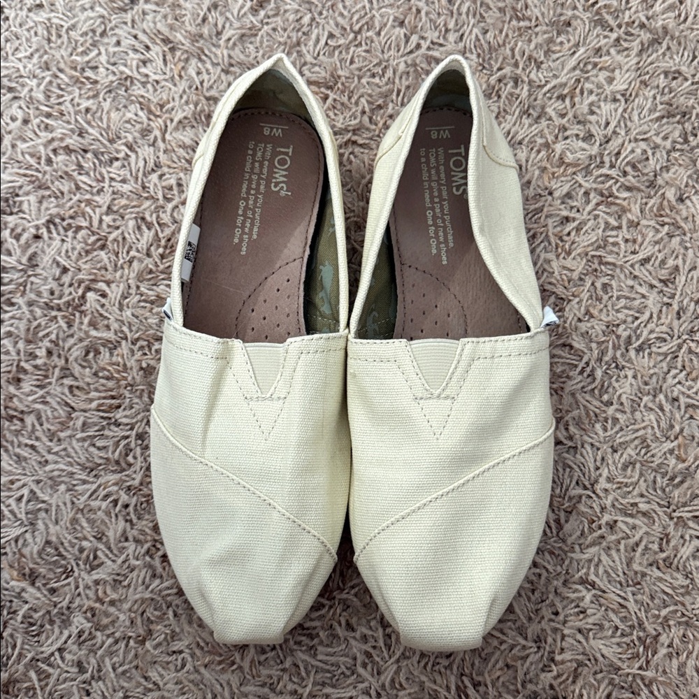 TOMS Light Tan Canvas Slip-Ons